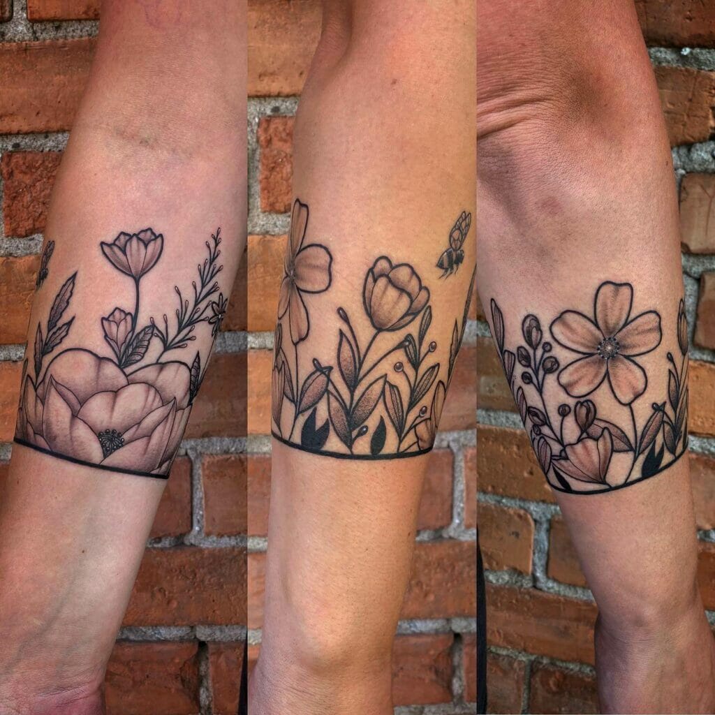 Floral Band Tattoo with Various Wildflowers and Bee Accents