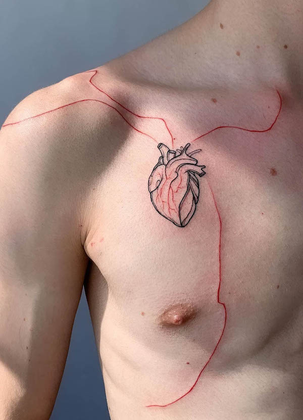 Anatomical heart tattoo with flowing red line design on chest and shoulder