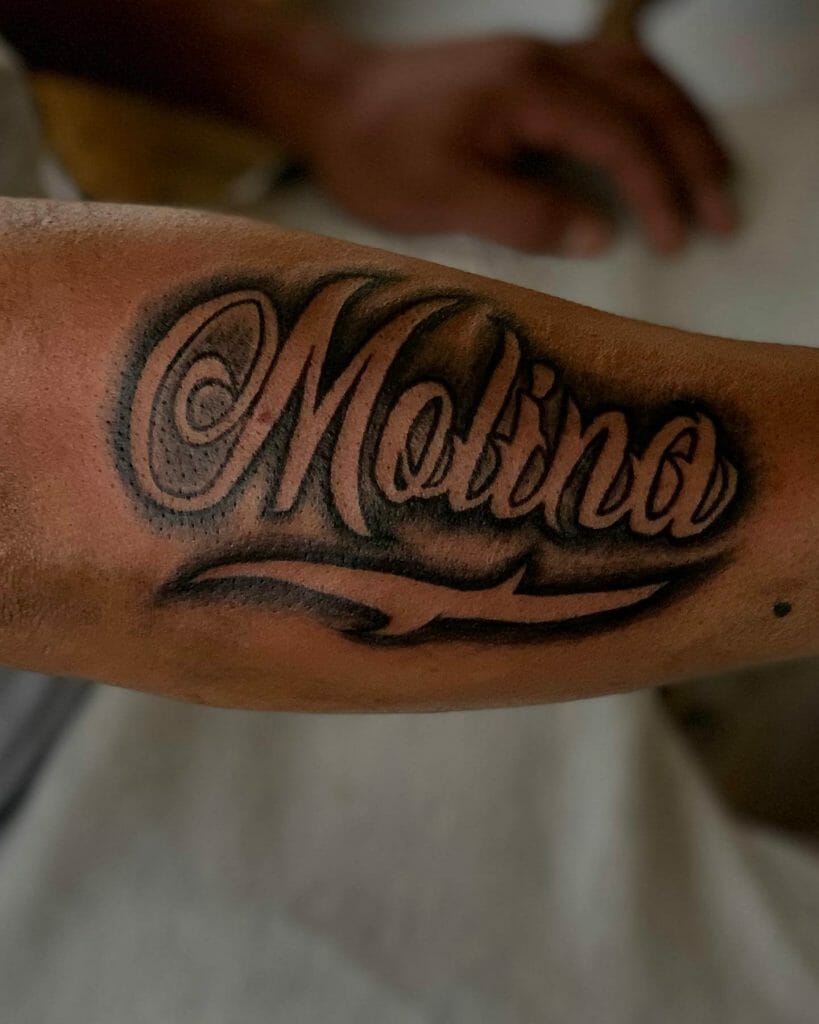  Dynamic Ink Black Work Last Name Tattoo