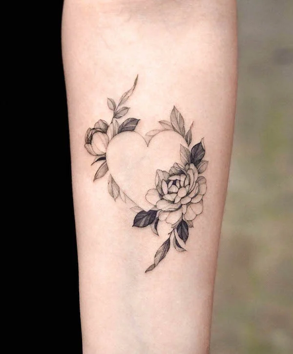 Floral heart outline tattoo with peony and rose accents in black and gray shading