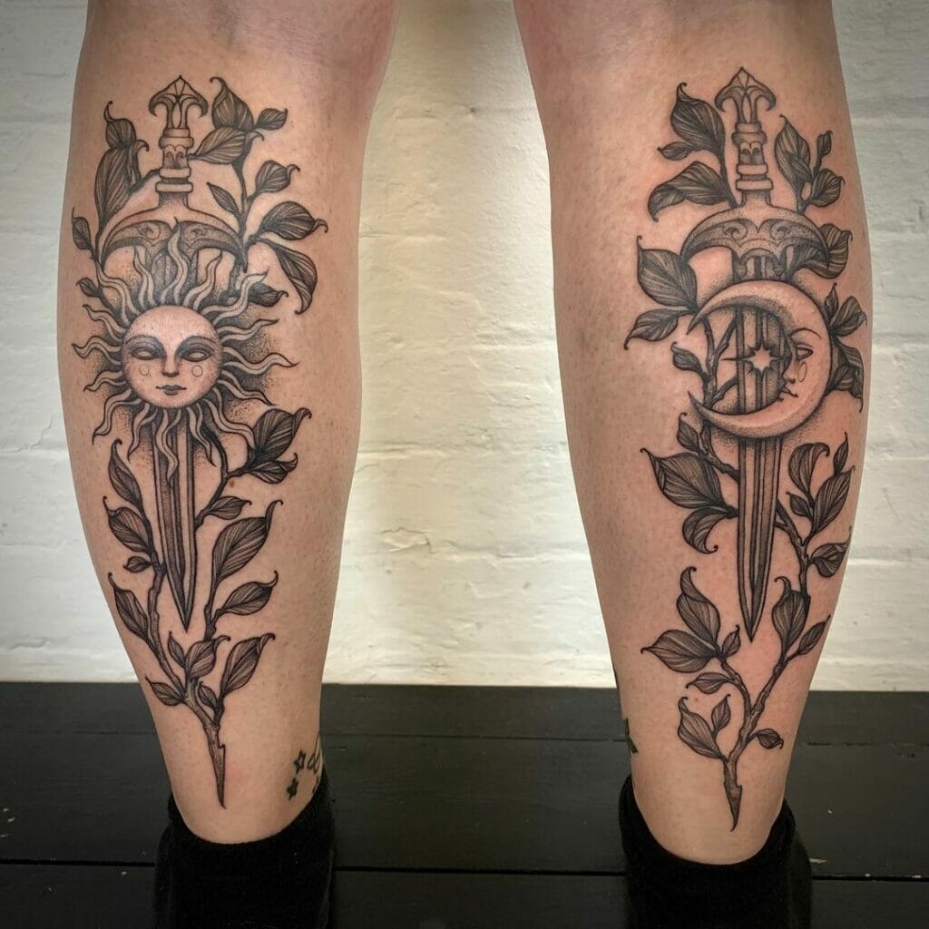 Elegant sun and moon leg tattoos featuring swords and leafy designs in black ink