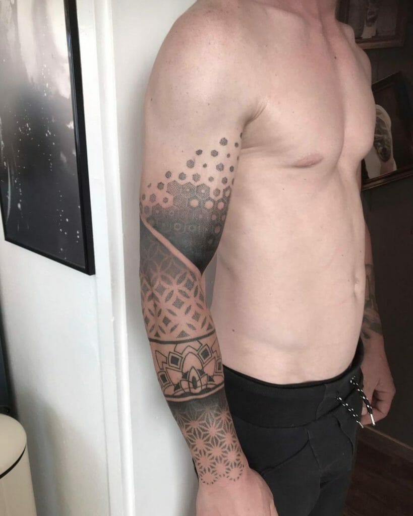 Black sleeve tattoo with lines and dots