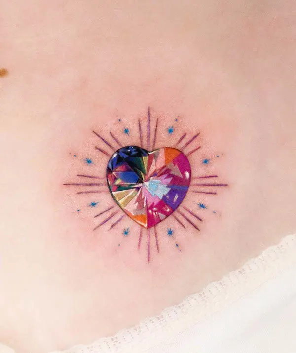 Colorful crystal heart tattoo design with radiant light effects and star accents