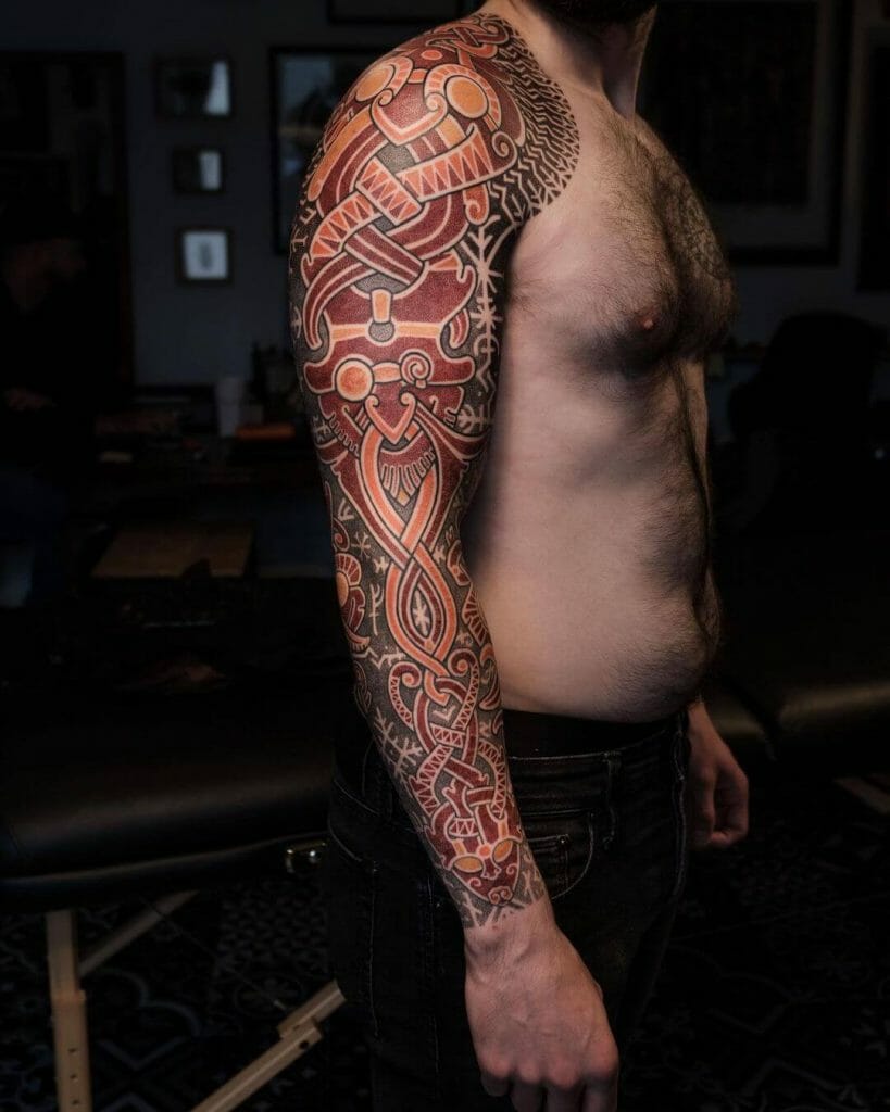 The colorful sleeve tattoo with a Nordic motif