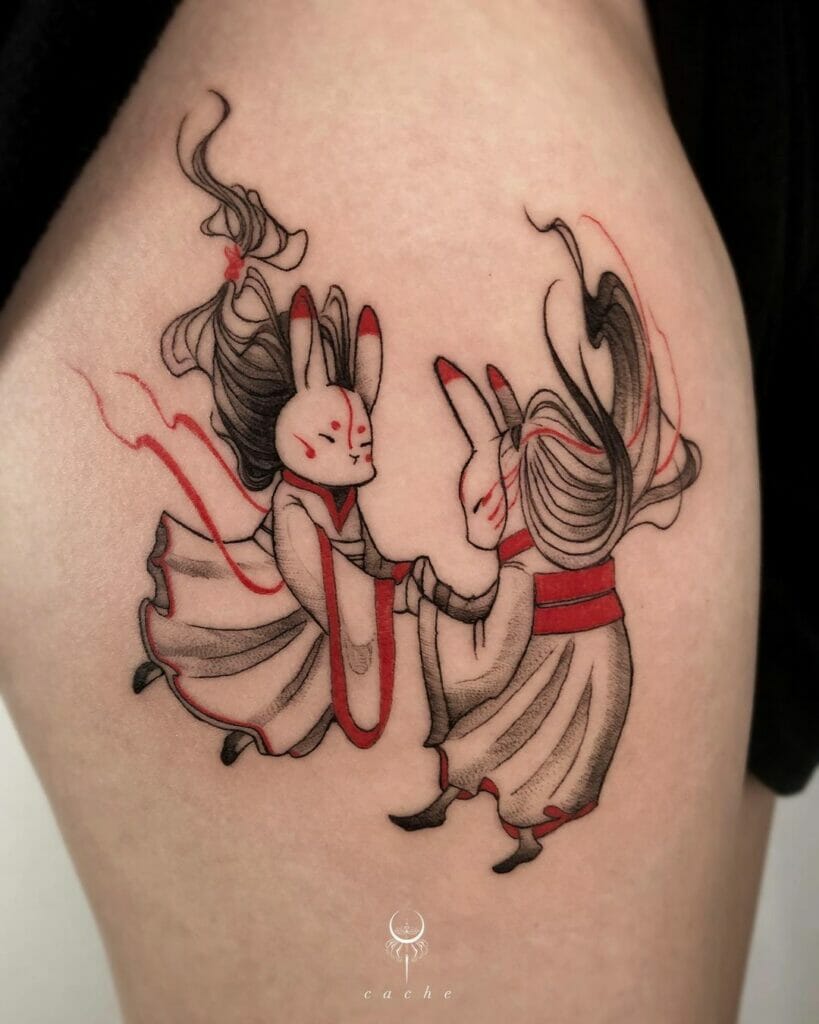 Whimsical tattoo of two rabbits in traditional attire dancing with flowing hair and red accents