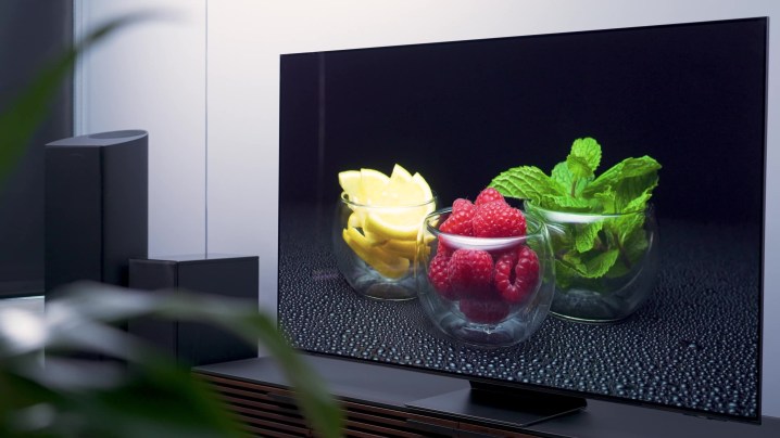 An image of a bowl containing lemons, raspberries and mint is displayed on a Samsung S95C.