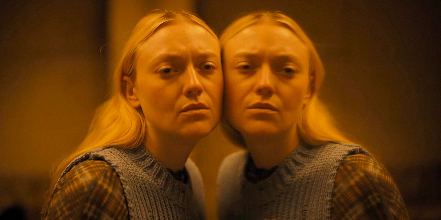 Mina (Dakota Fanning) presses her face against her reflection in the mirror in The Watchers