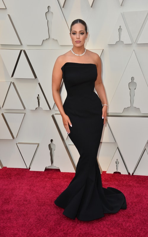 Ashley Graham in a long black dress on the red carpet