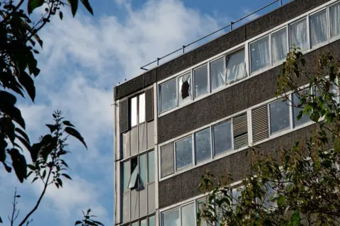 Laurence Cawley/BBC The Missenden block on the Aylesbury estate. One of the windows is broken on the top floor