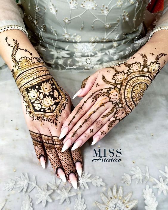 Intricate floral and geometric Mehndi design on the back of both hands with bold detailing, perfect for modern brides