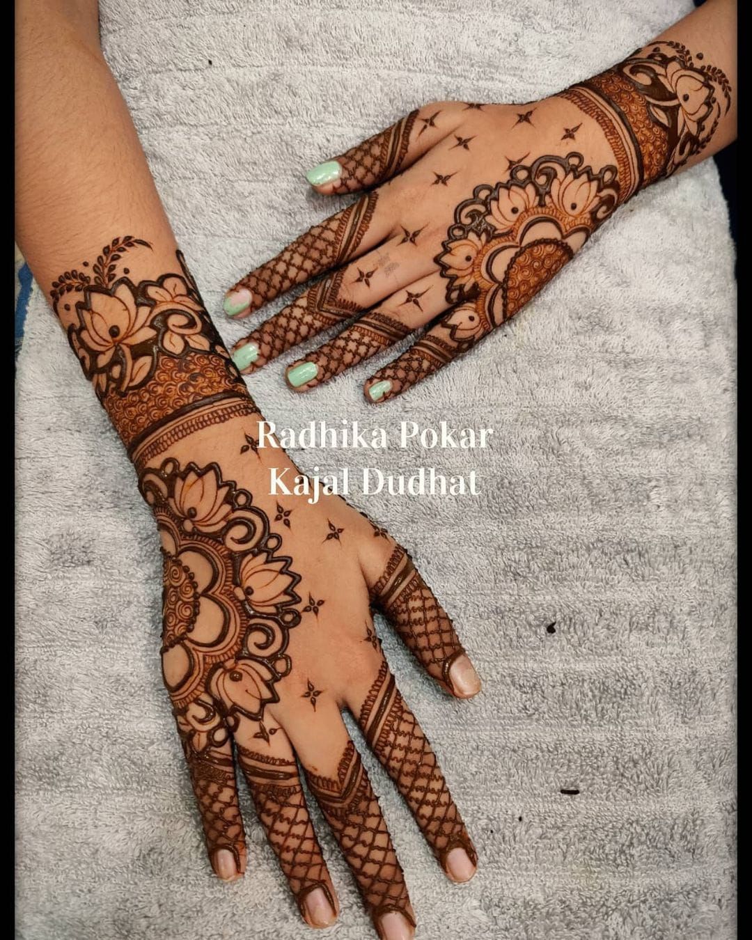 Floral and mesh Mehndi design on the back of the hands with bold floral motifs and intricate mesh patterns on the fingers, ideal for bridal and festive occasions