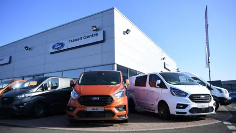 ANDY RAIN/EPA-EFE/REX/Shutterstock Ford vehicles at a Ford Transit centre in London, Britain, 14 February 2023