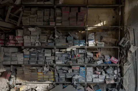 Part of a ruined shoe shop. Thousands of businesses in Lebanon have lost their premises and stock.