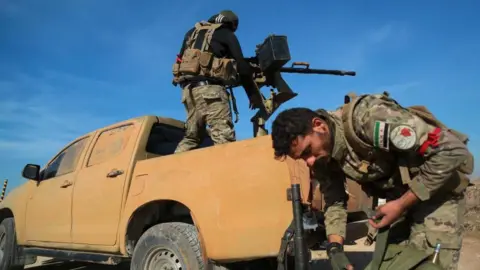 Reuters A rebel fighter stands on back of a truck holding a weapon in Menagh, north of Aleppo, Syria, December 2