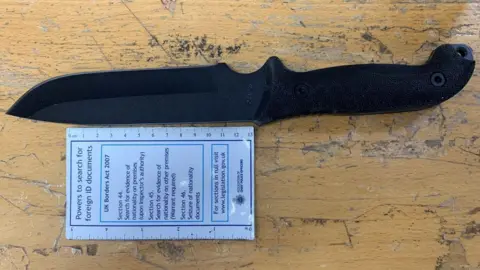 Metropolitan Police The black hunting knife carried by Cavan Medlock during his attack on the law firm