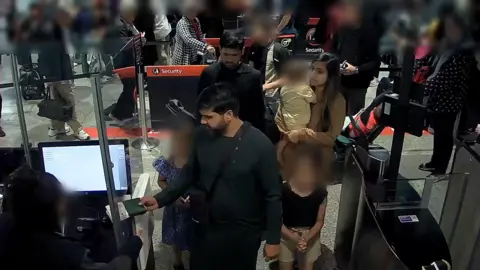 Surrey Police CCTV images of Urfan Sharif, Beinash Batool and Faisal Malik at Heathrow Airport