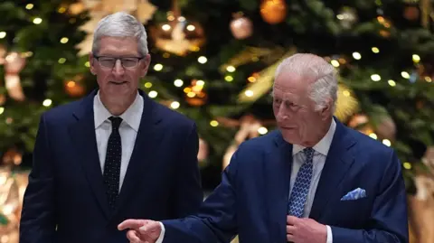 PA Media Chief executive Tim Cook welcomed the King to Apple's offices in Battersea