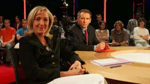 Getty Images Image shows Marine Le Pen and François Bayrou on the show You Be the Judge on April 27, 2006