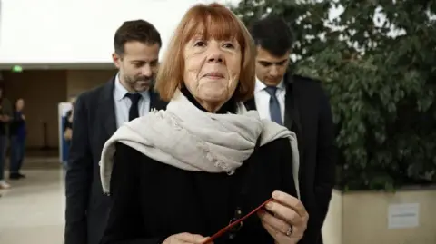 EPA Gisèle seen walking down a road