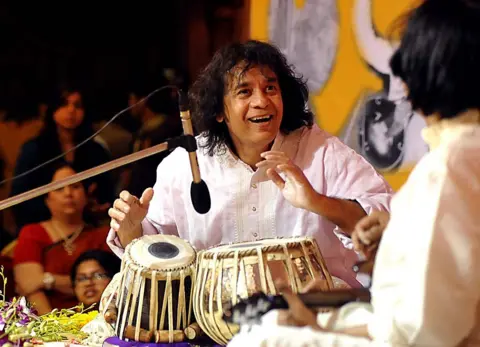 AFP Indian tabla player Ustad Zakir Hussain performs with Mandolin player U. Srinivas for the 14th Vasantotsav in Mumbai on February 27, 2014. 