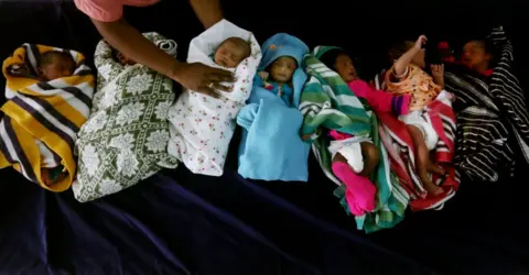 Getty Images Newly born babies rest inside a ward on the occasion of World Population Day at Government Children's Hospital in Chennai.