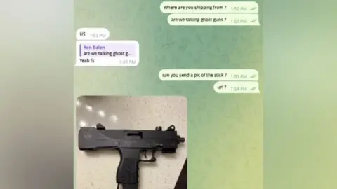 A screenshot of messages exchanged on Telegram, beginning with a message sent by Prof Maimon using the alias "Ron Balon", asking "Are we talking ghost guns?" The user replies "US", answering an earlier question about where he was shipping them from, and adds "Yeah fs" in answer to the ghost gun question. "Ron" asks for an image of the "stick" and the other user sends a picture of a black Uzi submachine gun resting on what appears to be a quartz counter