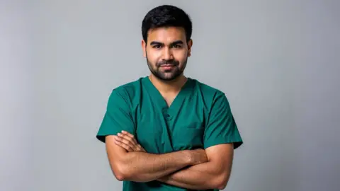 Bilal Mateen Bilal Mateen in surgical scrubs