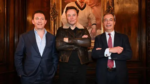 Reform UK/PA Nick Candy, Elon Musk and Nigel Farage pose for a photo