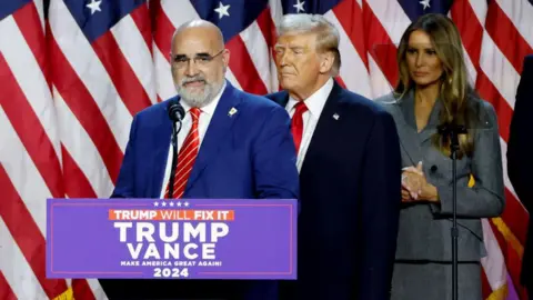 Getty Images Chris LaCivita (centre) speaking at an election night event at the Palm Beach Convention Center in West Palm Beach, Florida, United States, on November 06, 2024.