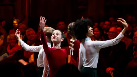 PA Media Four children perform a ballet routine at the Together at Christmas event