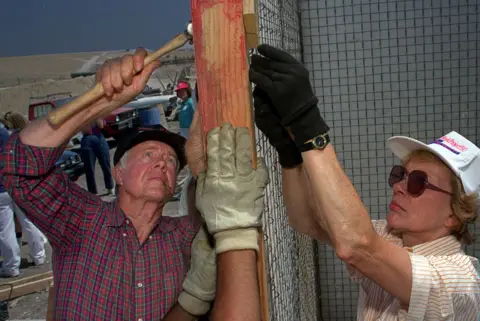 Getty Images Carter and his wife Rosalynn help construct one of 100 houses at a Habitat For Humanity project in Tijuana.