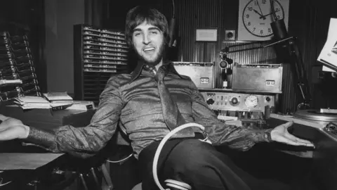 Black and white photo of Johnnie Walker in the Radio One studio