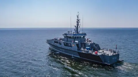 Estonian military A patrol ship called the Raju sails on the sea on a sunny day