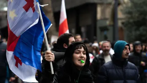 Getty Images Private sector workers and students take to the streets on a 16th day of protests in Georgia