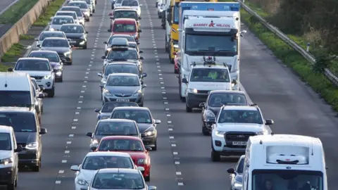 Getty Images Vehicles queue in a traffic jam as rain on the M5 motorway on October 25, 2024 near Locking, England.