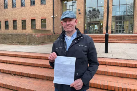 BBC Garry Kay standing outside Derby Combined Court Centre on 6 December 2024