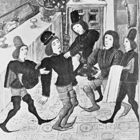 Getty Images Black and white drawing of five medieval men cavorting wearing poulaines