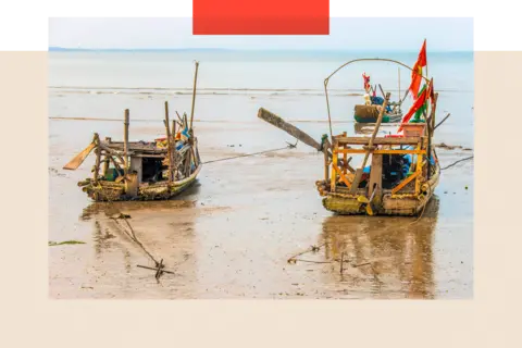 Getty Images Bamboo fishing boats on the beach at low tide in Nghe An province Vietnam