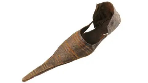 London Museum A long pointy poulaine shoe in brown leather